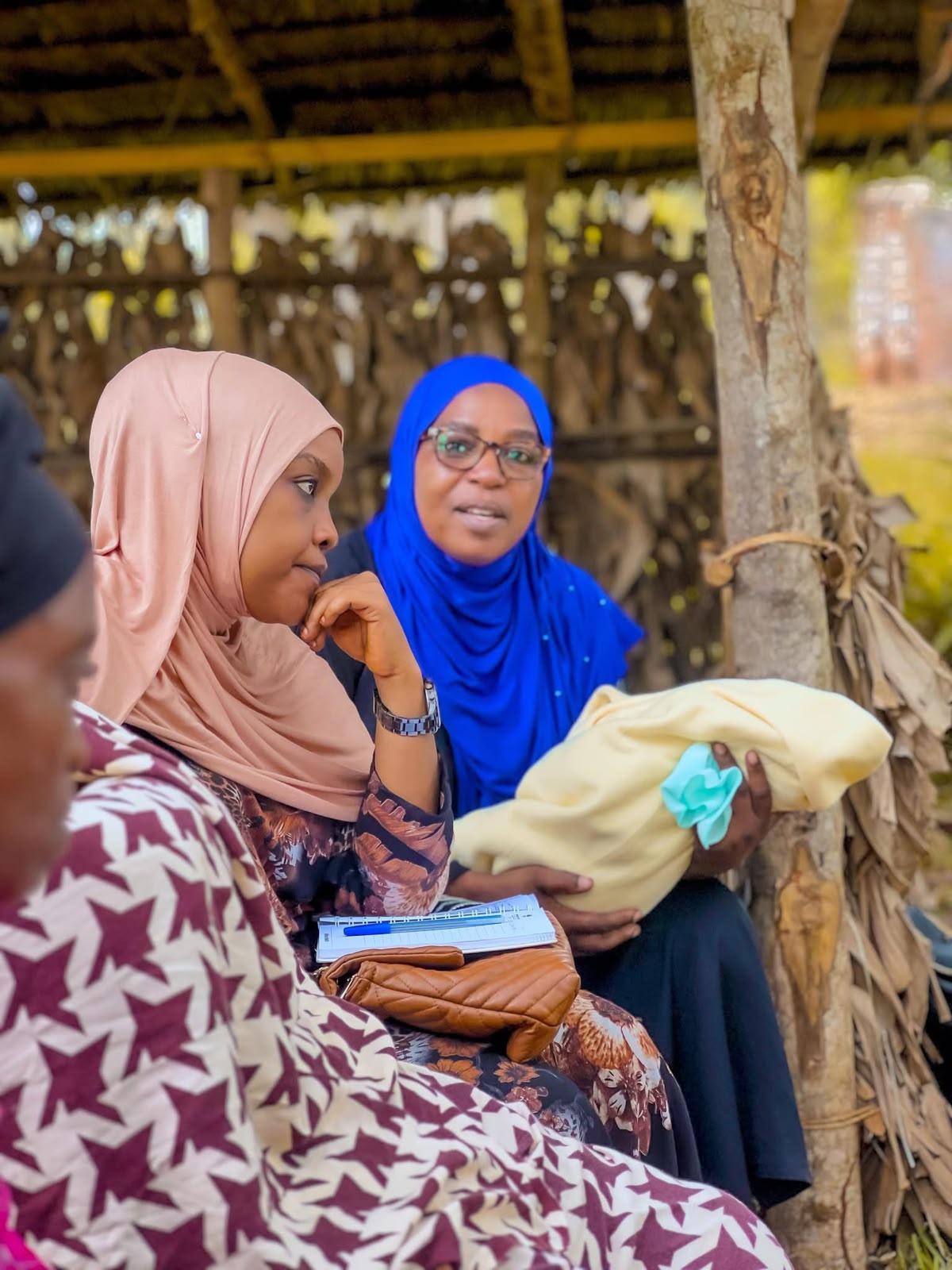 Mother caring for her child in the community